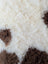 Cream and brown tibet highland spotted sheepskin rug with soft fluffy texture grade a- sheepskins