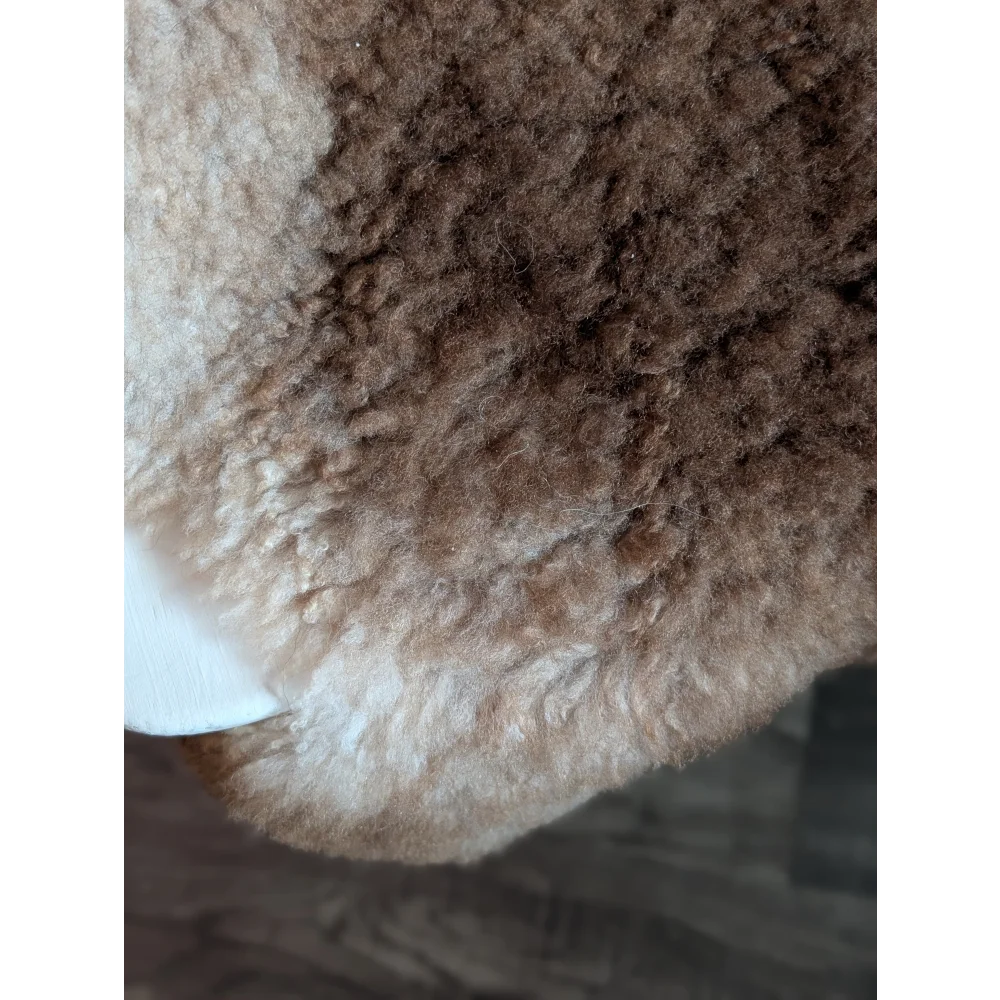 Cozy brown and cream tibet highland spotted grade a- sheepskin rug with soft curly texture perfect for home decor