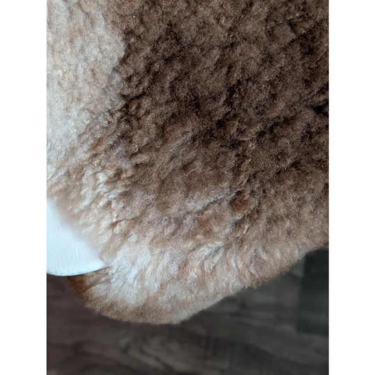 Cozy brown and cream tibet highland spotted grade a- sheepskin rug with soft curly texture perfect for home decor