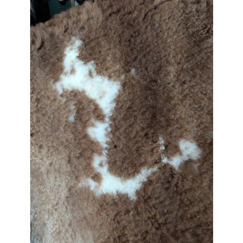 Brown fluffy tibet highland spotted sheepskin rug with white patchwork design grade a- sheepskins