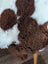 Brown and white tibet highland spotted sheepskin paw print rug made from grade a- sheepskins nat’s grade quality