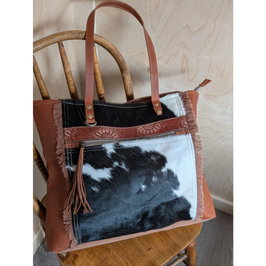 Brown leather oakley bag with real cowhide black and white patchwork frayed edges and embossed strap spacious bag