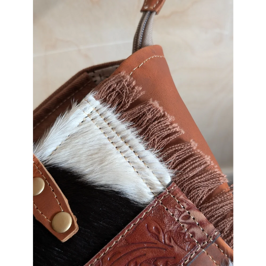 Brown oakley bag with real cowhide fringe spacious design detailed stitching and embossed floral patterns