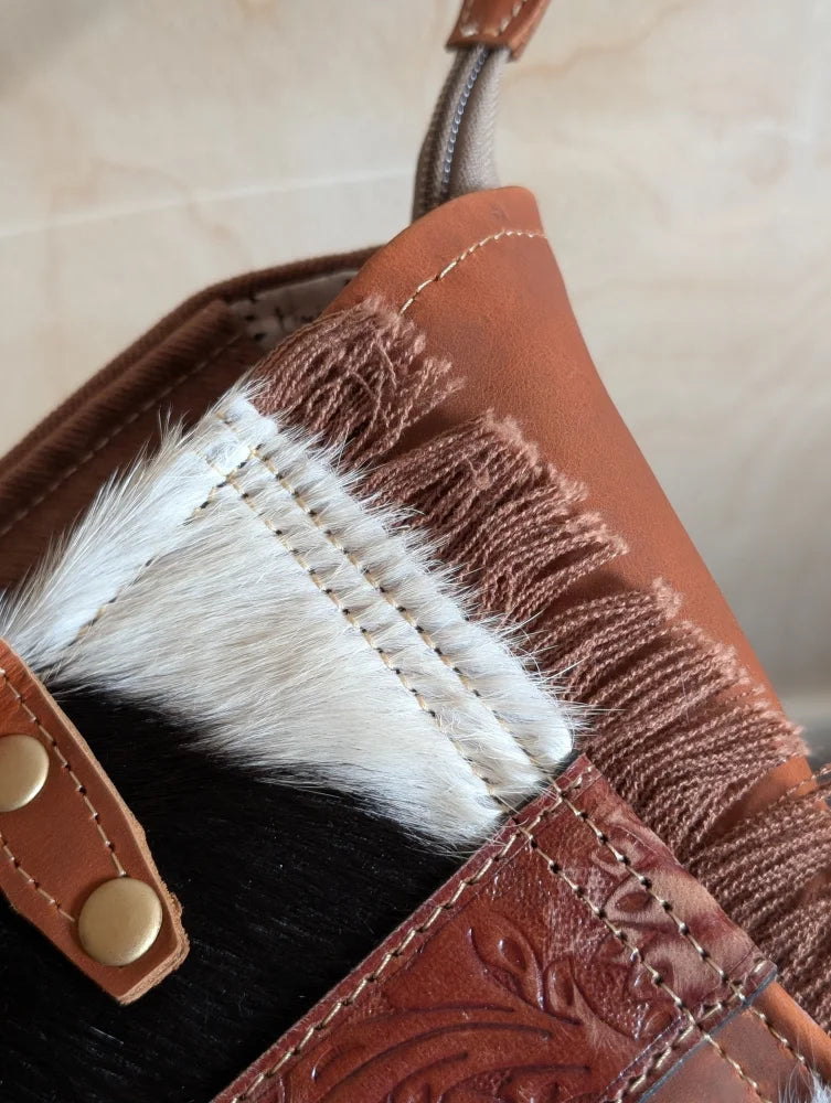 Brown oakley bag with real cowhide fringe spacious design detailed stitching and embossed floral patterns