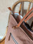 A soft rose oakley specks canvas tote bag with real cowhide straps, zipper closure, and spacious white lining interior