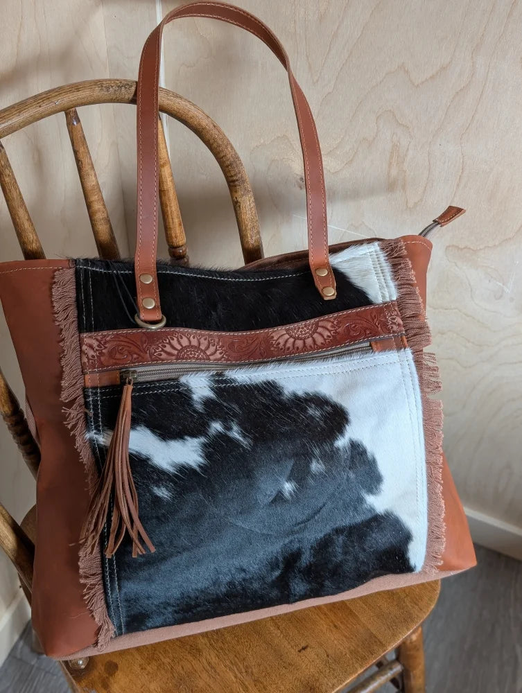 Brown leather oakley bag with real cowhide black and white patchwork frayed edges and embossed strap spacious bag