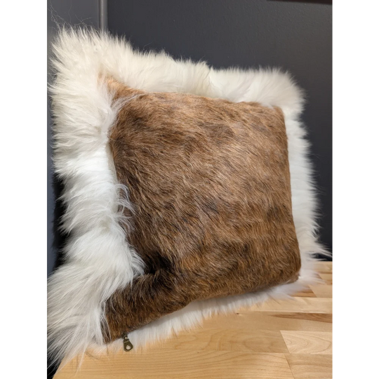 A cozy square cowhide merino sheepskin cushion with brown textured fur and plush white faux-fur border