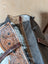 The sunflower weekender bag is a rustic brown cartwright hand-tooled bag with intricate floral tooling and hair-on hide trim