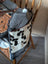 The sunflower weekender bag is a rustic cartwright hand-tooled bag with hair-on hide patchwork and a zippered pocket