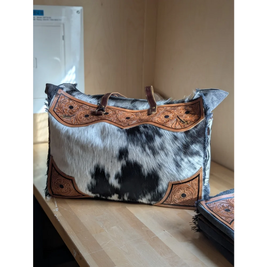 Black and white cowhide sunflower weekender bag with brown leather embroidery and zippered pocket hair-on hide cartwright hand-tooled bag