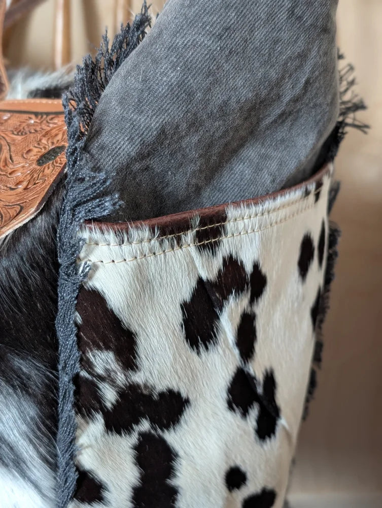 The sunflower weekender bag black and white hair-on hide zippered pocket with brown stitched frayed edges