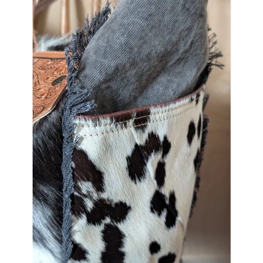 The sunflower weekender bag black and white hair-on hide zippered pocket with brown stitched frayed edges