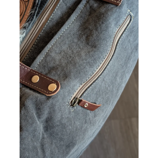 Gray canvas tote sunflow weekender bag with brown leather accents zippered pocket and brass hardware