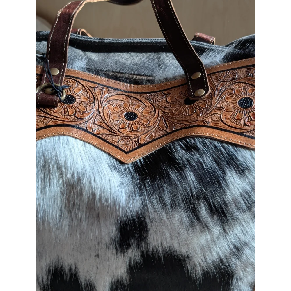 Brown leather cartwright hand-tooled bag strap with intricate floral tooling and brass hardware for the sunflower weekender bag