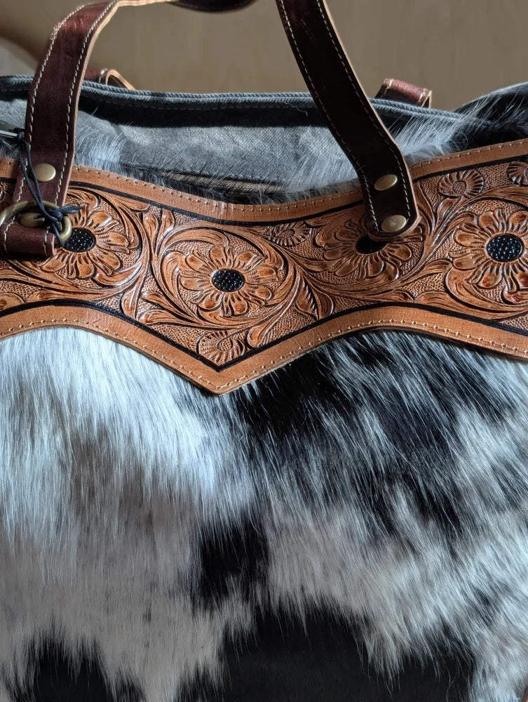 Brown leather cartwright hand-tooled bag strap with intricate floral tooling and brass hardware for the sunflower weekender bag