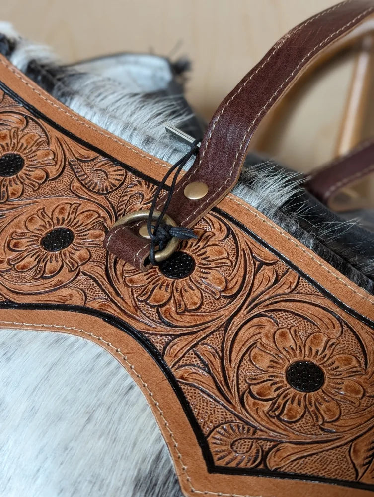 Brown leather horse halter with floral tooled patterns and black stitched outlines by cartwright hand-tooled bag