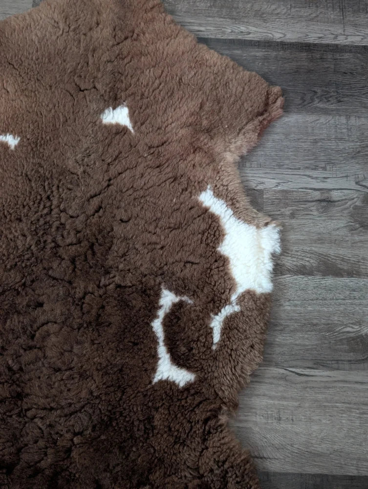 Brown and white grade a- sheepskin rug with natural texture tibet highland spotted nat’s grade design