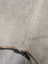 Gray large cowhide rug with natural texture and contrasting dark brown black fringe 77.5 by 66 lovely cowhide