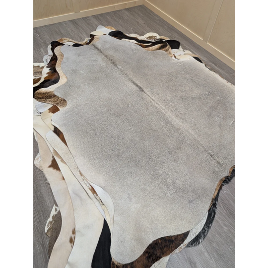 Large cowhide rug with a soft gray center and black and white speckled border lovely cowhide 77.5 x 66 inches