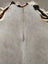 Large lovely cowhide rug gray with textured surface and distinctive black and white patterned border 77.5 x 66 inches