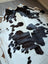 Large lovely cowhide rug in black and white with natural irregular edges perfect as a stylish floor accent
