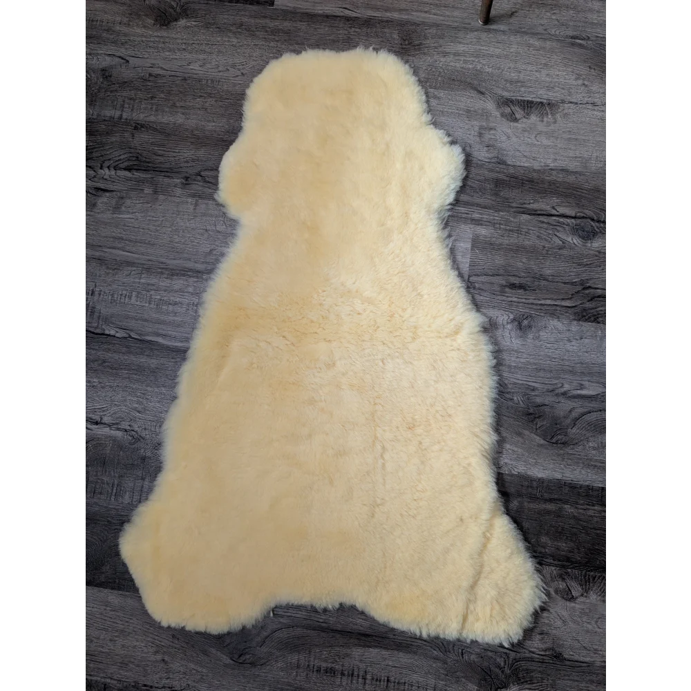 Soft cream-colored medical sheepskin rug, 44.5x24in shearling wool for blood flow
