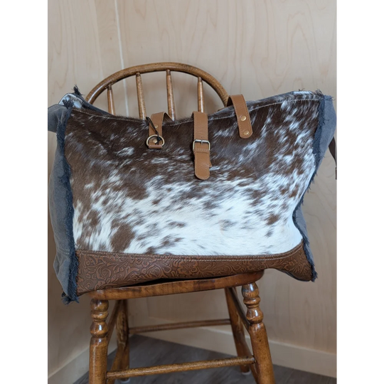 Brown and white cowhide matty affair canvas tote bag with tan leather straps and embossed base by angus oliver