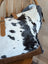Black and white cowhide affair canvas hair tote bag with tan leather straps and brown embossed trim by angus oliver