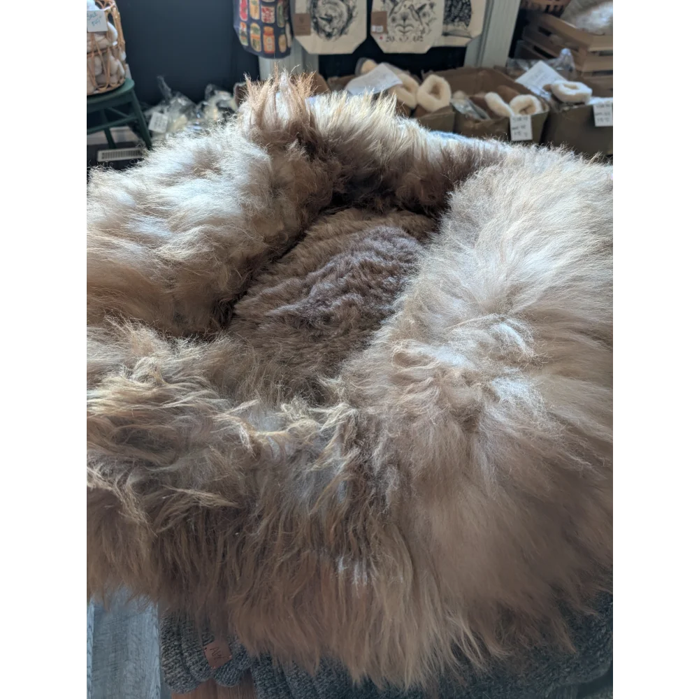 Cozy #7 Long Wool sheepskin pet bed with soft tan and white fur rug