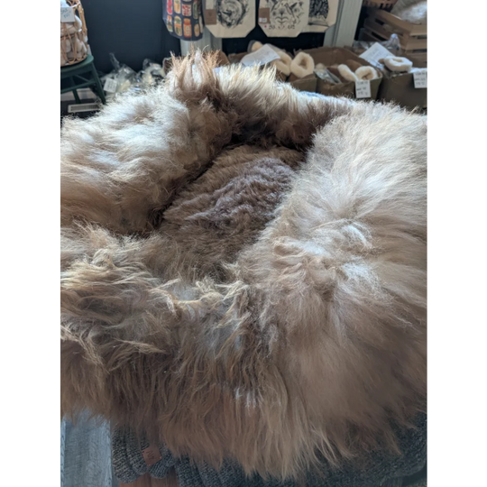 Cozy #7 Long Wool sheepskin pet bed with soft tan and white fur rug