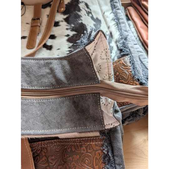 Gray denim tote bag with brown leather accents and zipper closure from angus oliver matty affair canvas collection