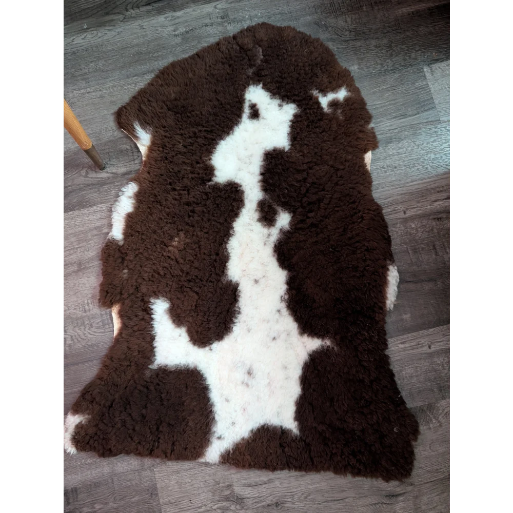 Brown and white highland spotted grade a- sheepskin rug with plush soft texture for cozy home decor