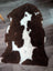 Brown and white highland spotted grade a- sheepskin rug with plush soft texture for cozy home decor