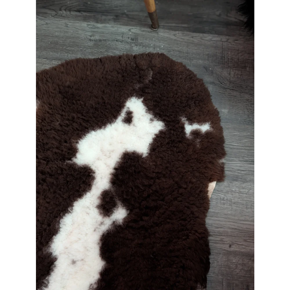 Brown and white fluffy tibet highland spotted grade a- sheepskin rug with a soft textured surface
