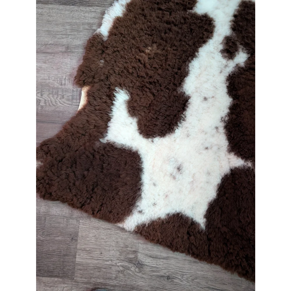 Brown and white highland spotted grade a- sheepskin rug with soft fur perfect for cozy home decor