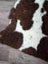 Brown and white highland spotted grade a- sheepskin rug with soft fur perfect for cozy home decor