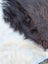 Large cowhide rug with thick plush black and white fur showcasing unique characteristics perfect for beautiful rugs