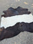 Large black and white belted galloway cowhide rug with unique characteristics and beautiful irregular patterns