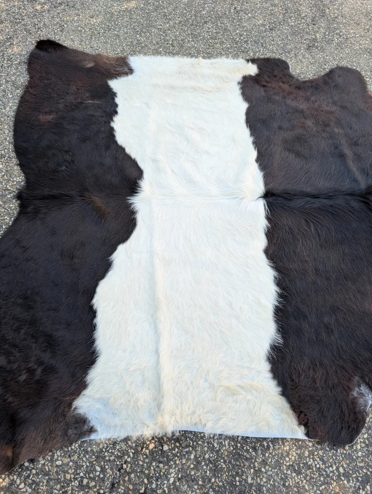 Natural black and white large cowhide rug with plush soft texture and unique characteristics perfect for beautiful rugs
