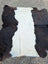 Natural black and white large cowhide rug with plush soft texture and unique characteristics perfect for beautiful rugs
