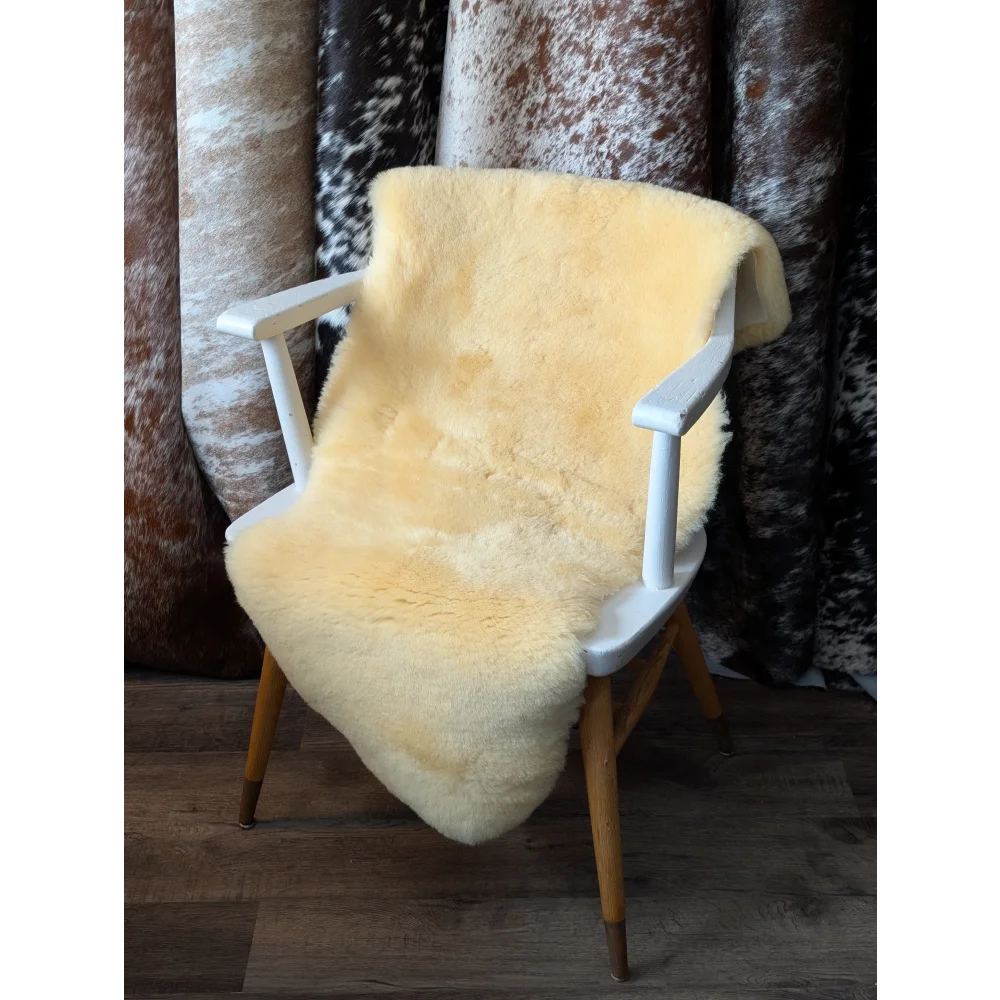 Yellow medical sheepskin throw on chair, shearling wool boosts blood flow