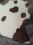 Cream-colored tibet highland spotted sheepskin rug with fluffy brown spots grade a- sheepskins perfect for cozy decor