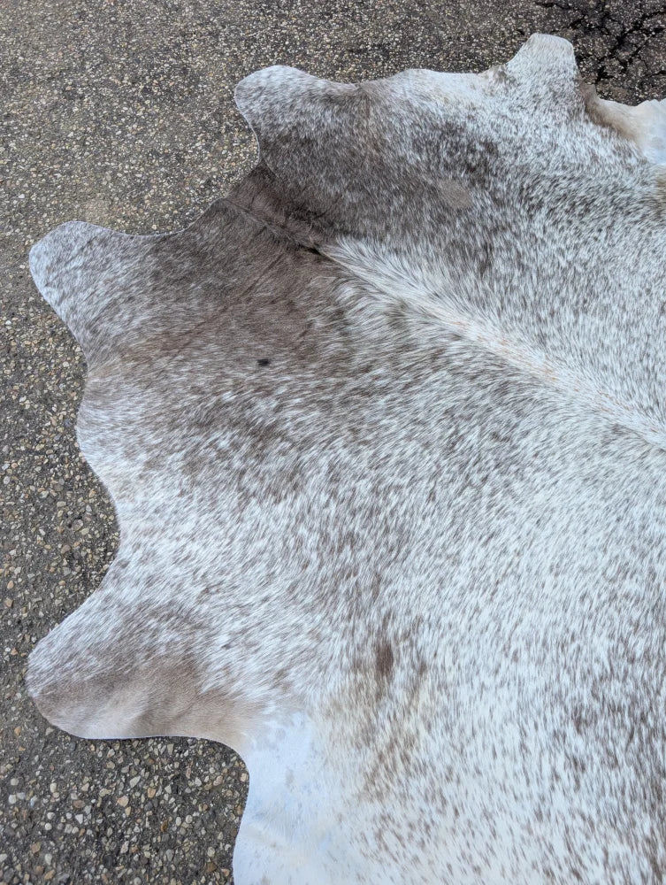 Large 89 x 77 grey mix #7 cowhide rug with natural gray and white speckled pattern showcasing rustic charm and unique characteristics