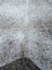 Large 89 x 77 gray mix 7 cowhide rug with speckled natural fur texture and unique characteristics for rustic charm
