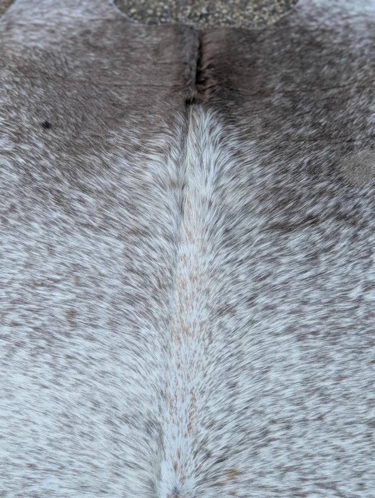 Large 89 x 77 gray mix #7 cowhide rug with speckled gray and white fur texture adds rustic charm and unique characteristics