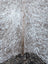 A large 89 x 77 inch grey mix #7 cowhide rug with white and gray speckled fur and unique rustic charm