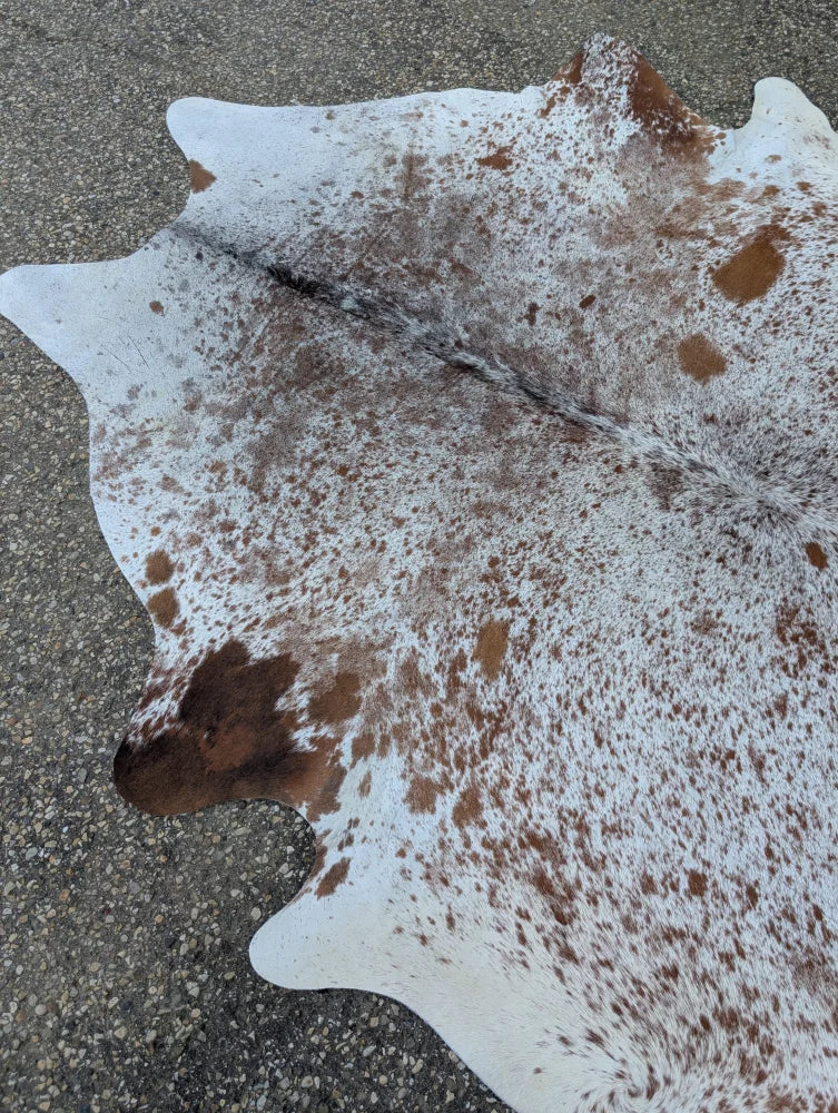 89 x 77 saltpepbrn214 large cowhide rug with white and brown speckles showcasing unique characteristics and rustic charm