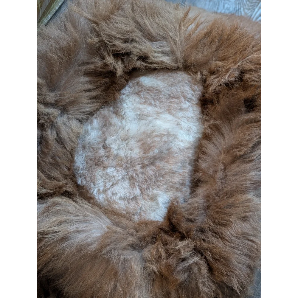 Cozy tan faux fur highland sheepskin pet bed with white heart design