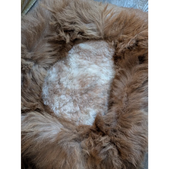 Cozy tan faux fur highland sheepskin pet bed with white heart design