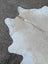 92 x 81 large cowhide rug in off-white and beige with soft texture and unique characteristics for rustic charm